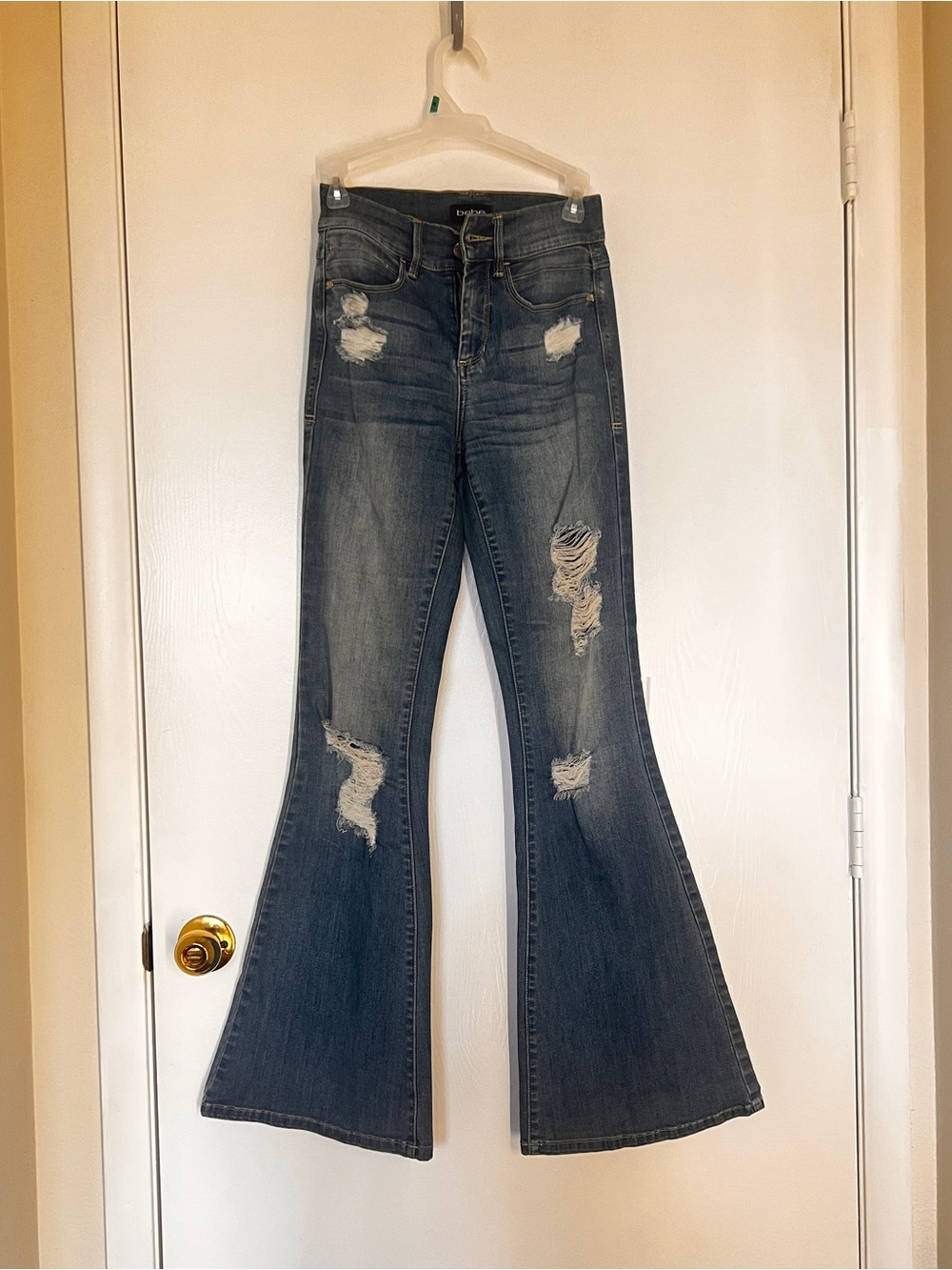 Blue distressed Women’s flare jeans Bebe size 0 XS